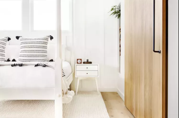 21 Small Primary Bedroom Ideas That Feel Bigger Than They Are Try a Four-Poster Bed - Trinette Reed / Stocksy