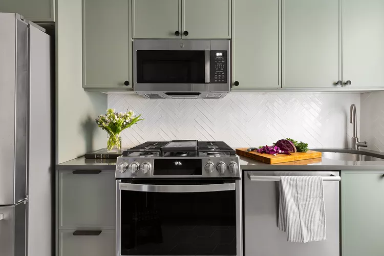 9 Fresh Paint Colors Designers Are Loving - Grounding Green Cabinets