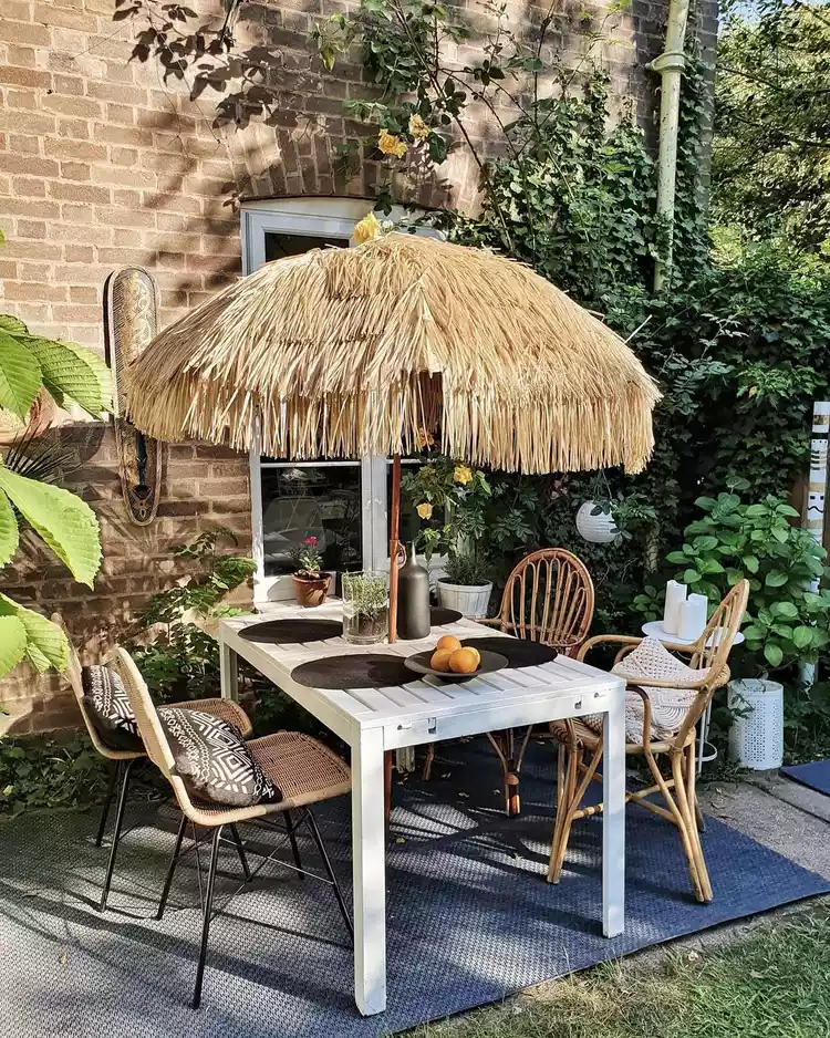 Fun outdoor dining table with tiki umbrella. 