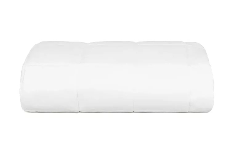 Slumber Cloud Core lightweight mattress pad on a bed