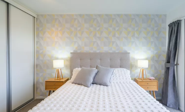 Small Primary Bedroom Ideas Use an Accent Wall to Your Advantage Nazar Abbas Photography via Getty Images