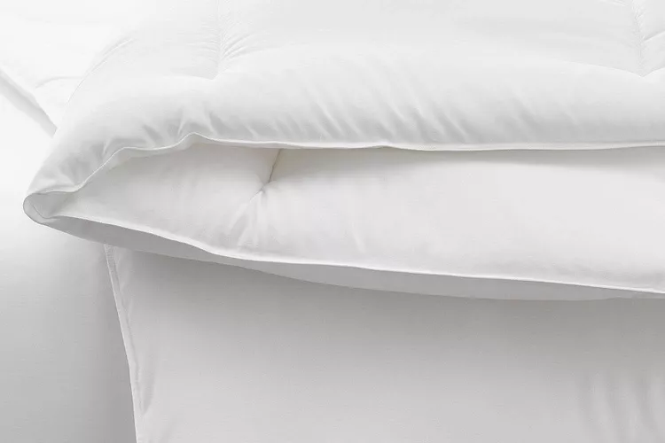 Pottery Barn down alternative duvet insert on a made bed