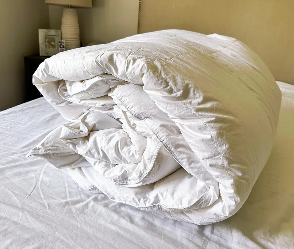 Brooklinen all-season down comforter on a bed