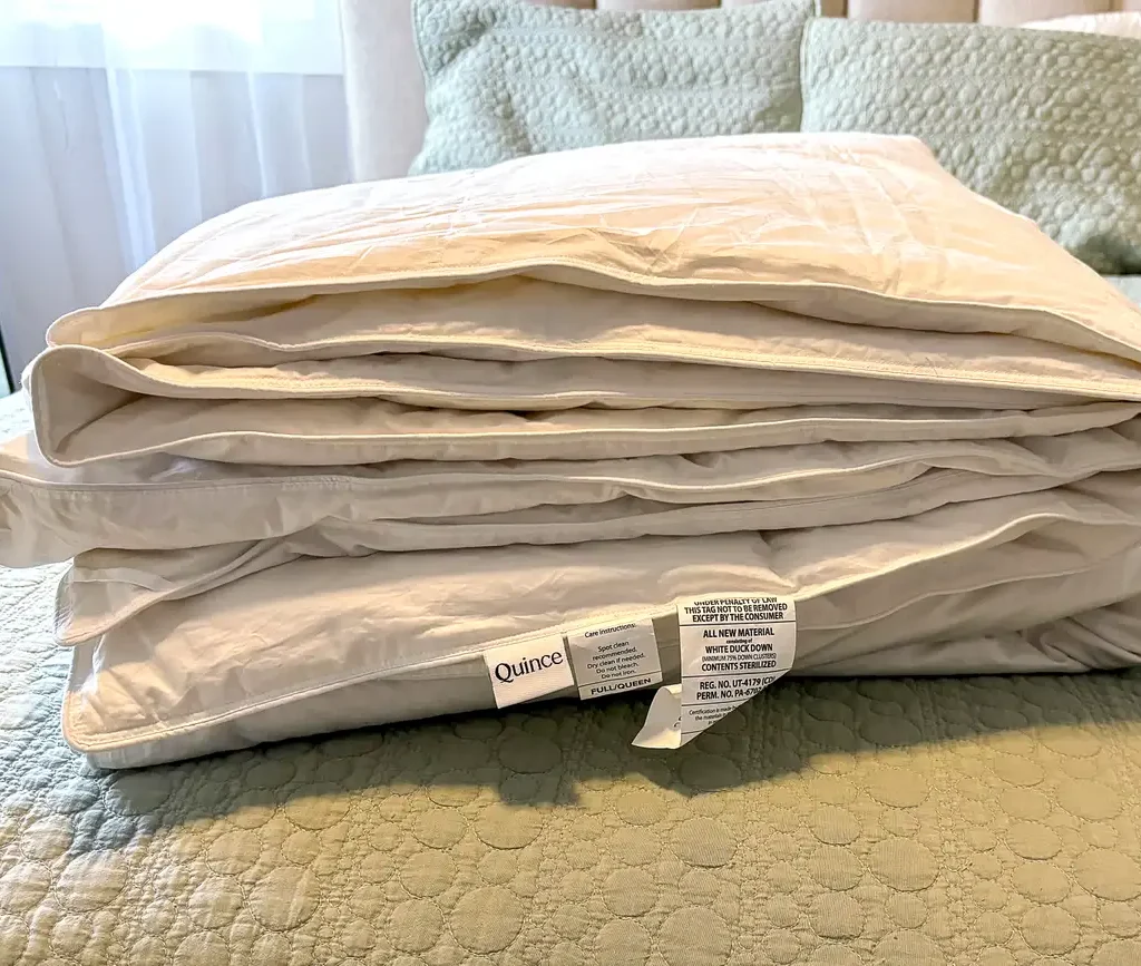 Quince premium down comforter folded over at the corner