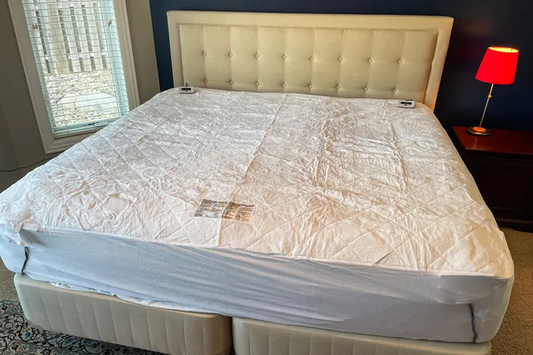 Sealy heated mattress pad with fleece top on a bed
