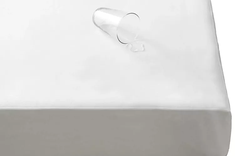 The Company Store cotton jersey waterproof mattress pad on a bed