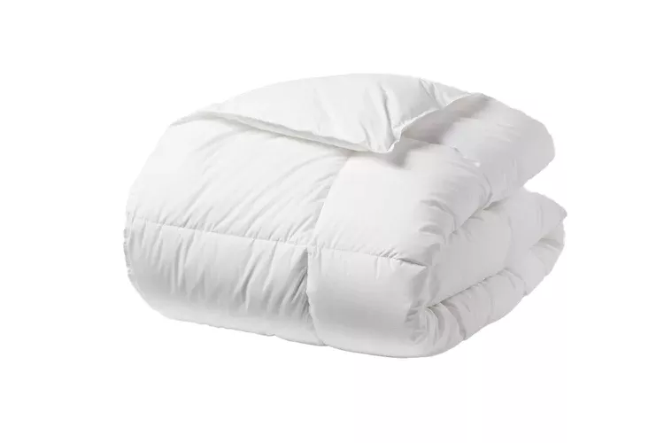Threshold all-season down alternative comforter on a bed