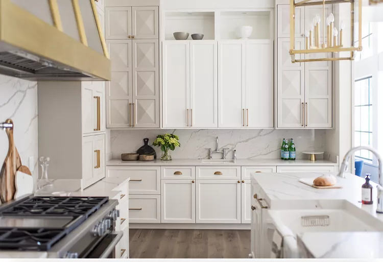 34 White and Gold Kitchen Ideas for a Luxe-23 White and Gold Kitchen With Wrapped Range Hood